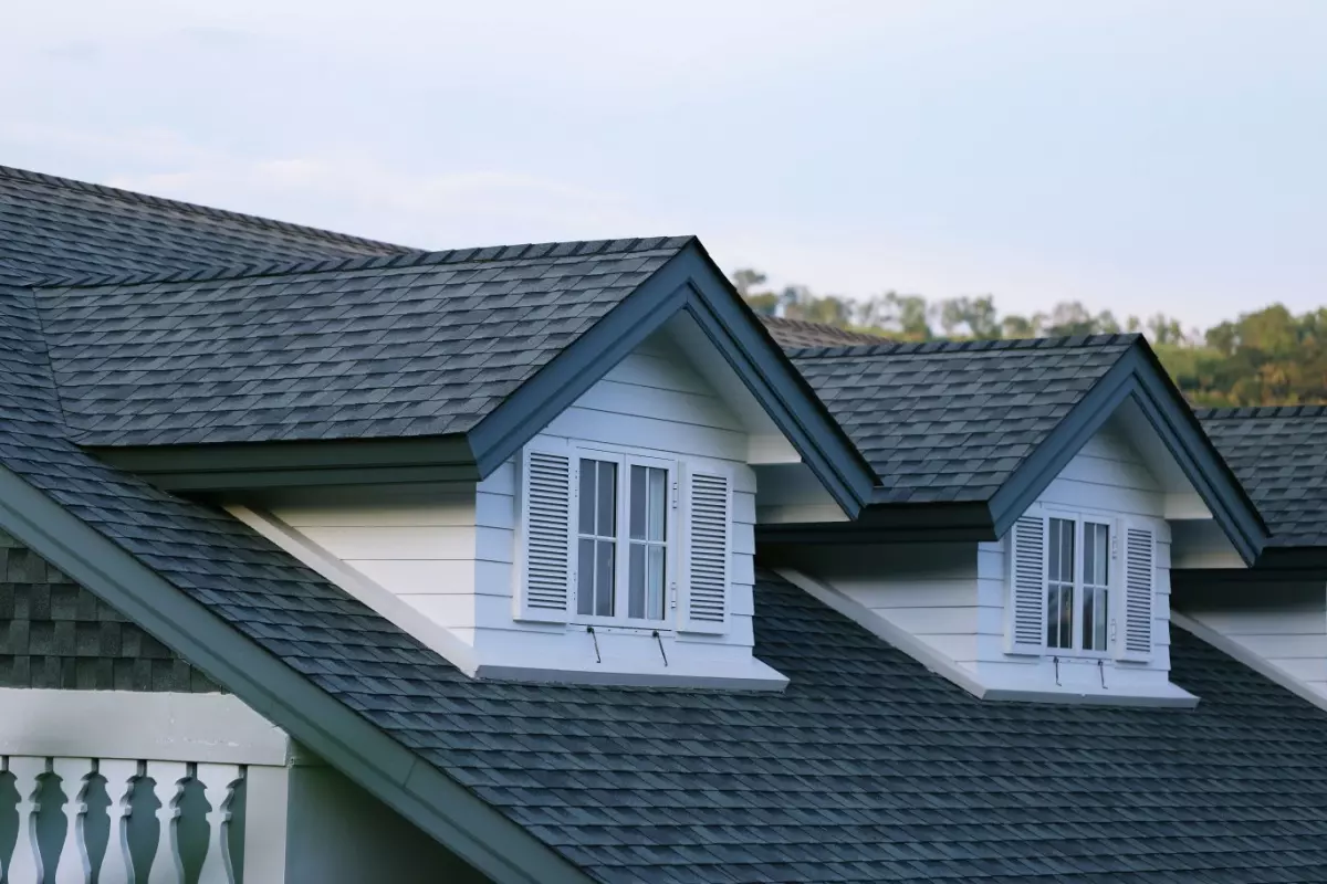 House with a gable roof with windows, illustrating different roof types
