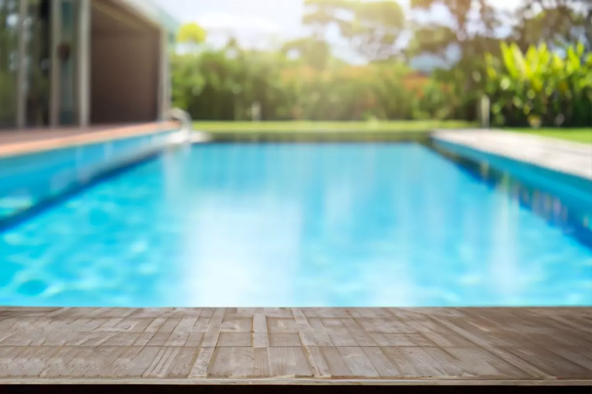 Clear blue pool in a serene backyard setting