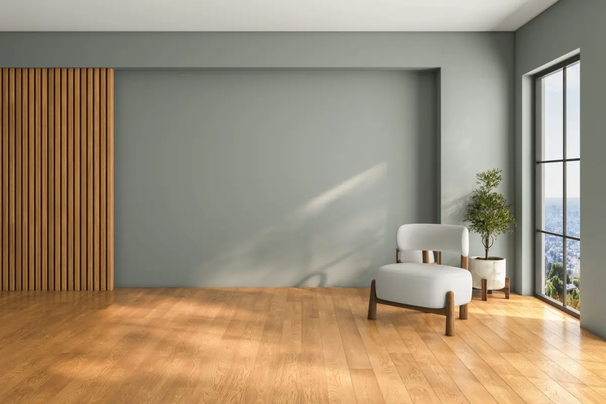 Modern, empty leaving room with wooden floor and white armchair.