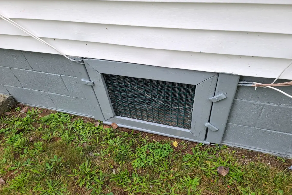 A metallic crawl space access door, for providing access to the crawl space beneath a house. 