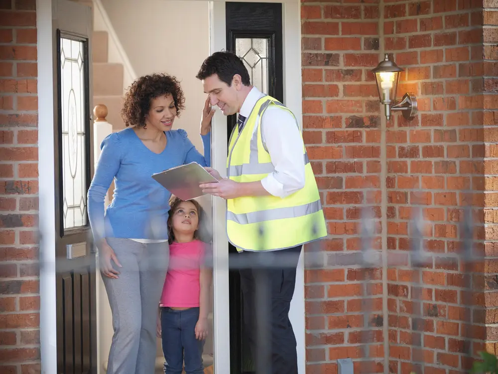 Homeowner reviewing energy-efficiency information with an adviser.