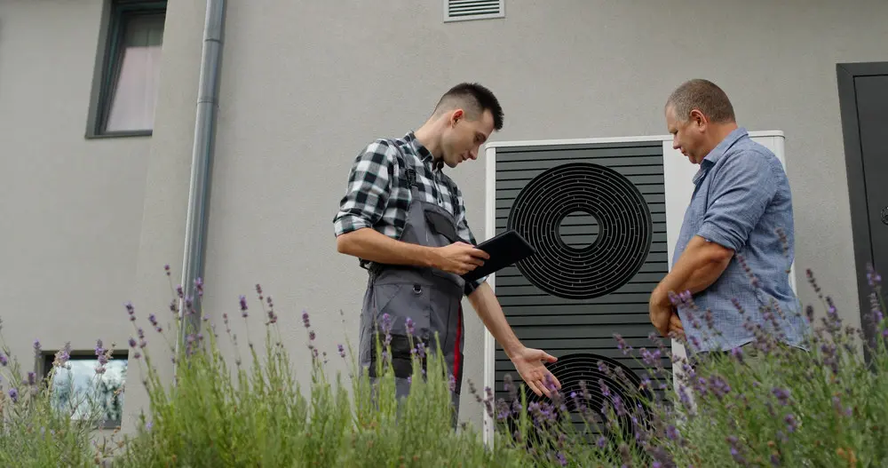Contractor meeting with homeowner about heat pump.