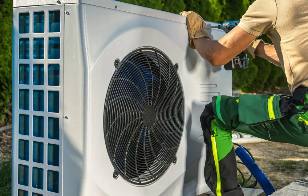 HVAC technician working on a residential heat-pump system