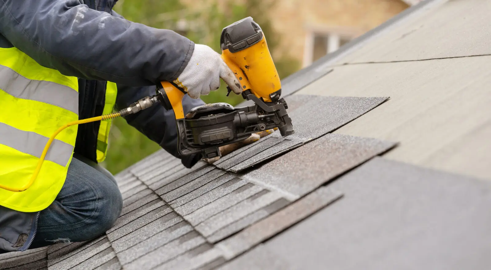 Experienced roofing specialist fixing metal roof panels