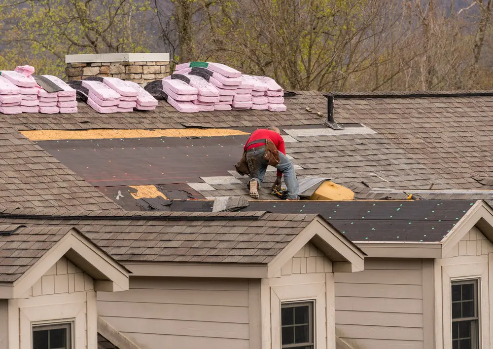 Townhouse roof prepared for new shingles after the old roofing was removed